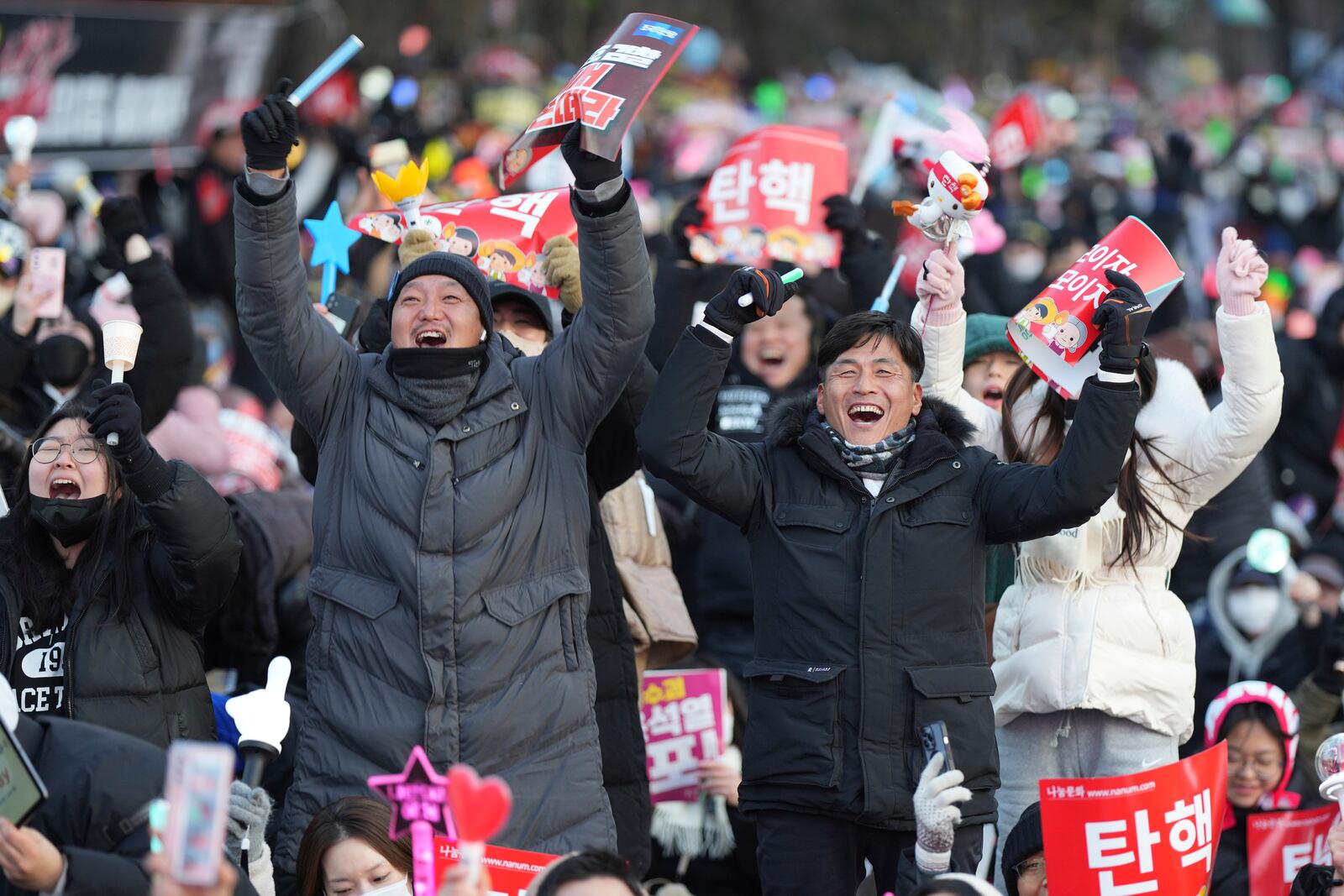 FILE - Participants celebrate after hearing the news that South Korea's parliament voted to impeach President Yoon Suk Yeol outside the National Assembly in Seoul, South Korea, on Dec. 14, 2024. (AP Photo/Lee Jin-man, File)