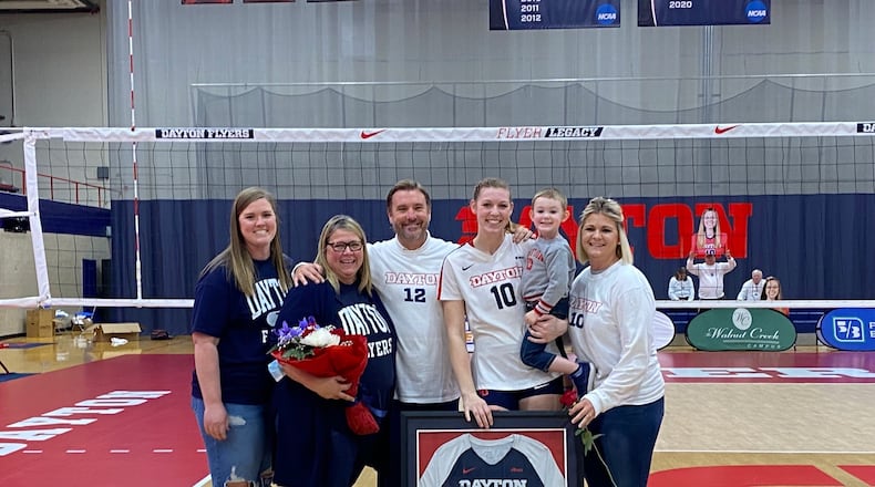 “It Takes a Village”: Jamie Peterson and her son are flanked by four of the people who have given her her most support. From left: sister Becka, mom Jenny, UD coach Tim Horsmon, Jamie and Carter and sister Kayla. CONTRIBUTED