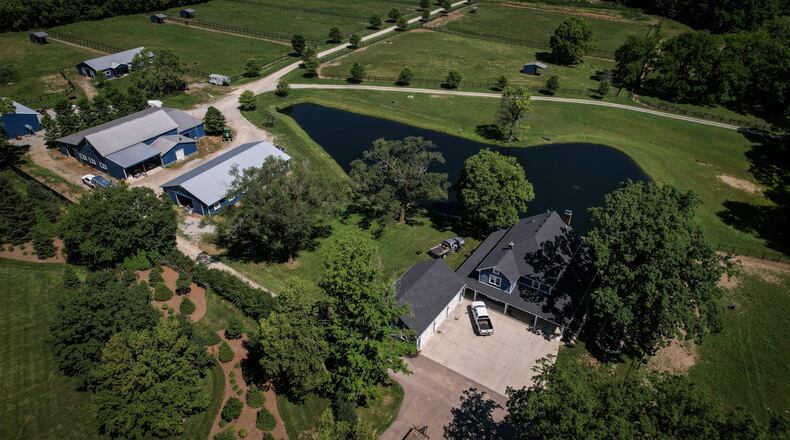 A Clearcreek Twp. police officer remains in critical condition after being shot in the 5000 block of Ohio 48 Wednesday evening. JIM NOELKER/STAFF