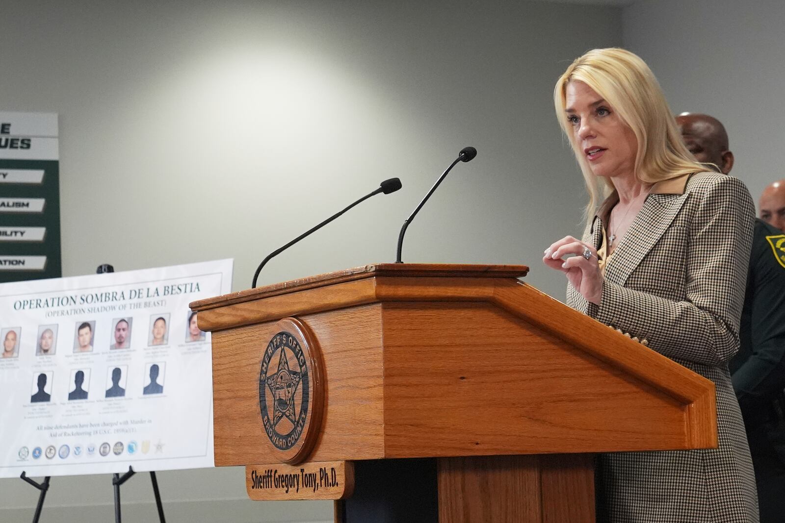 U.S. Attorney General Pam Bondi announces the arrest of gang members involved in four homicides, Friday, April 4, 2025, in Fort Lauderdale, Fla. (AP Photo/Marta Lavandier)