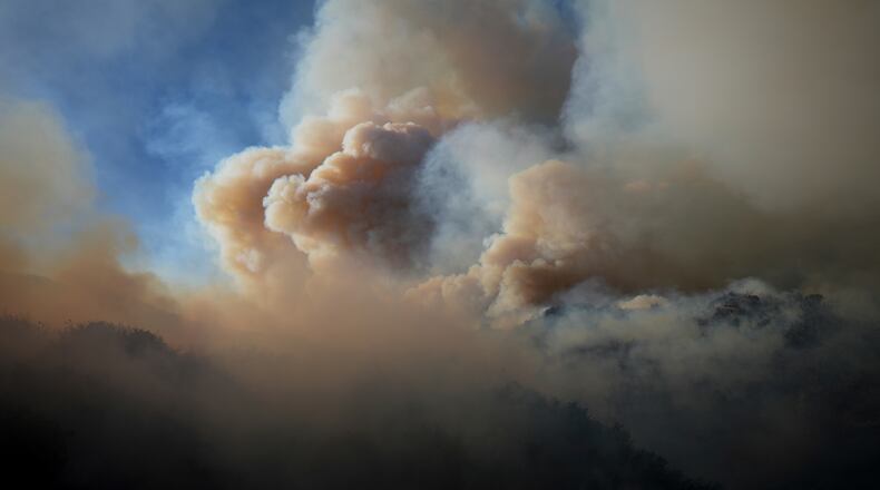 FILE - The Franklin Fire sends a plume of smoke into the sky, Dec. 10, 2024, in Malibu, Calif. (AP Photo/Eric Thayer, File)