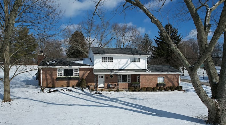 The renovated 4-bedroom home offers about 2,520 sq. ft. of living space. The front of the property features a stamped concrete driveway, covered front porch and updated landscaping. CONTRIBUTED PHOTO