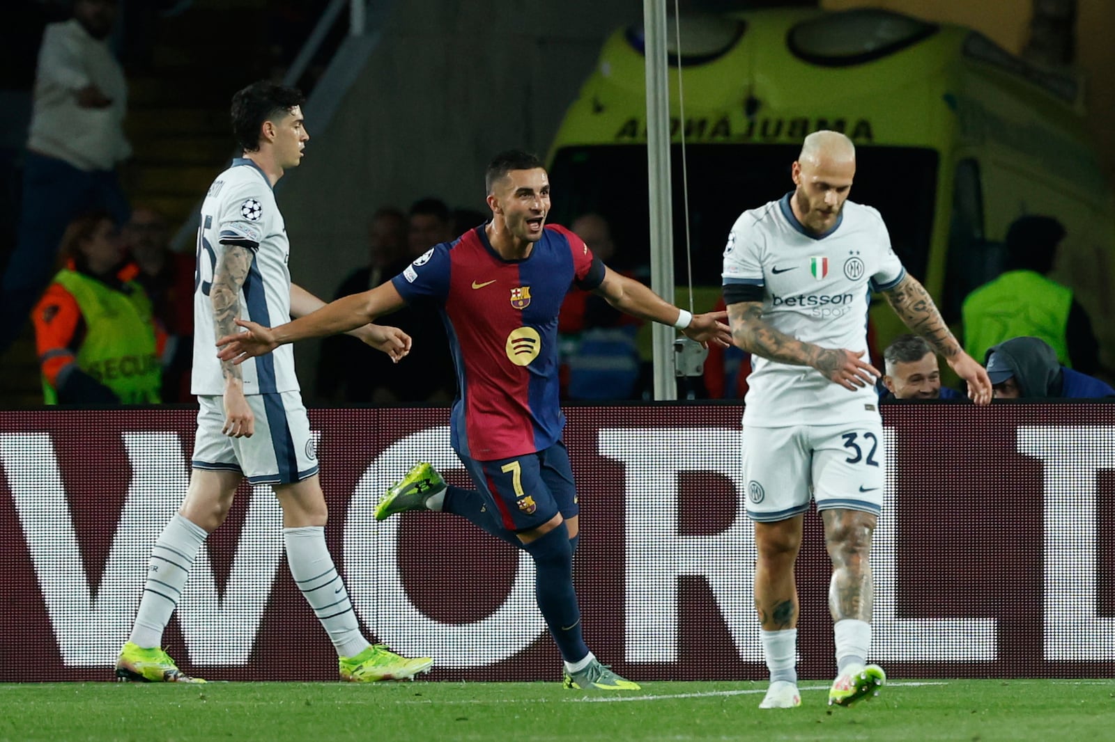 Barcelona's Ferran Torres, left, celebrates after scoring his side's second goal during the Champions League semifinal first leg soccer match between Barcelona and Inter Milan at the Lluis Companys Olympic Stadium in Barcelona, Spain, Wednesday, April 30, 2025. (AP Photo/Joan Monfort)