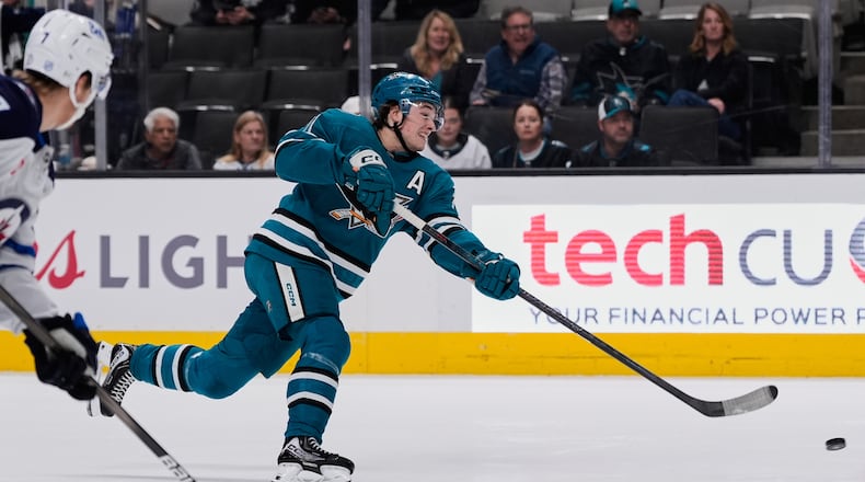 San Jose Sharks center Macklin Celebrini (71) shoots during the first period of an NHL hockey game against the Winnipeg Jets, Friday, Nov. 7, 2025, in San Jose, Calif. (AP Photo/Godofredo A. Vásquez)