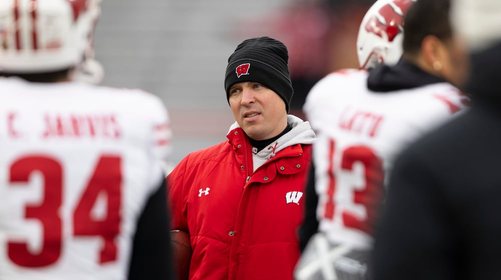 FILE - Wisconsin interim head coach Jim Leonhard leads warmups before playing against Nebraska in an NCAA college football game in Lincoln, Neb., Nov. 19, 2022. (AP Photo/Rebecca S. Gratz)