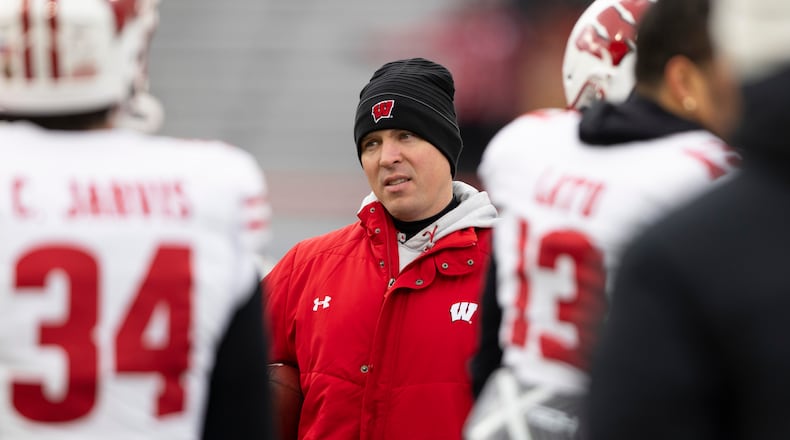 FILE - Wisconsin interim head coach Jim Leonhard leads warmups before playing against Nebraska in an NCAA college football game in Lincoln, Neb., Nov. 19, 2022. (AP Photo/Rebecca S. Gratz)