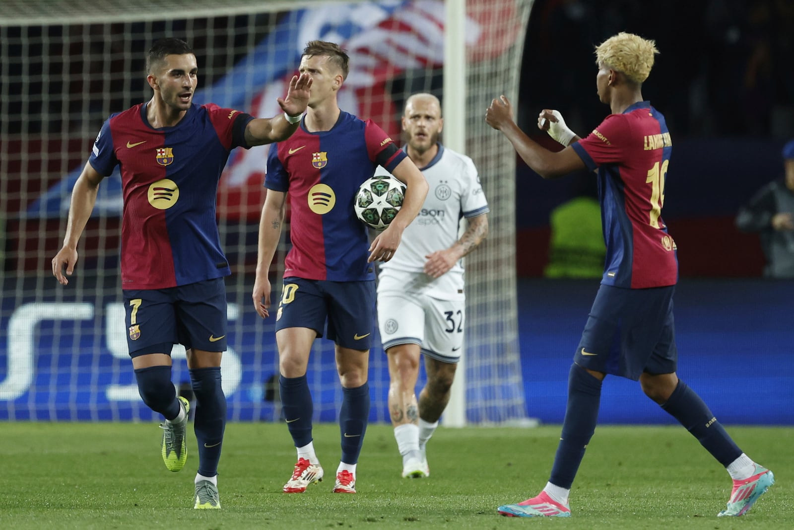 Barcelona's Ferran Torres, left, celebrates after scoring his side's second goal during the Champions League semifinal first leg soccer match between Barcelona and Inter Milan at the Lluis Companys Olympic Stadium in Barcelona, Spain, Wednesday, April 30, 2025. (AP Photo/Joan Monfort)