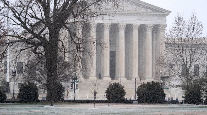 The U.S. Supreme Court as seen during a snowy day on Capitol Hill Thursday, March 12, 2026, in Washington. (AP Photo/Jose Luis Magana)