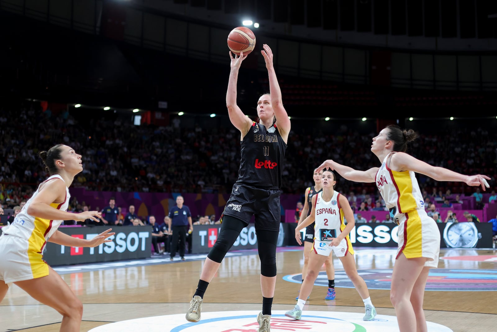 Belgium's Emma Meesseman, centre, tries to score against Spain, during the FIBA Women's EuroBasket 2025 final match between Spain and Belgium at the Peace and Friendship Stadium in Piraeus near Athens, Greece, Sunday, June 29, 2025. (AP Photo/Yorgos Karahalis)