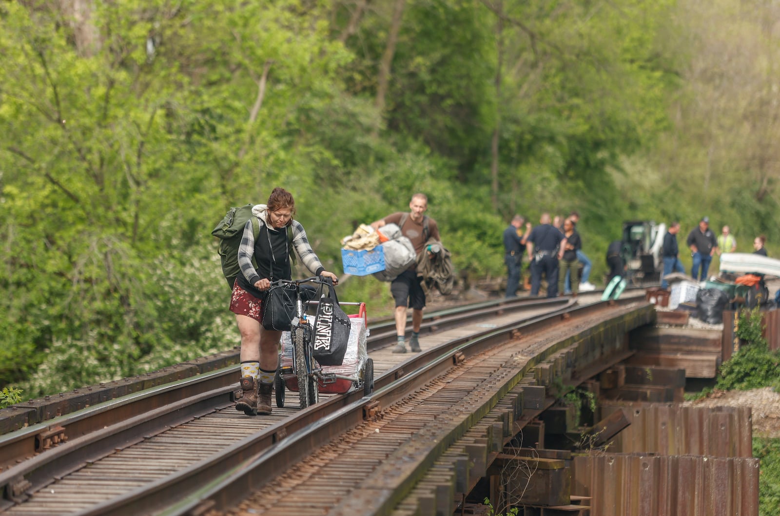 Residents leave homeless encampments with their belongings on Monday, May 5, 2025, at Snyder Park. JOSEPH COOKE/STAFF