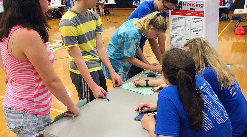 Greenon Jr/Sr High School students learn about how to handle money during an education experiment. JEFF GUERINI/STAFF