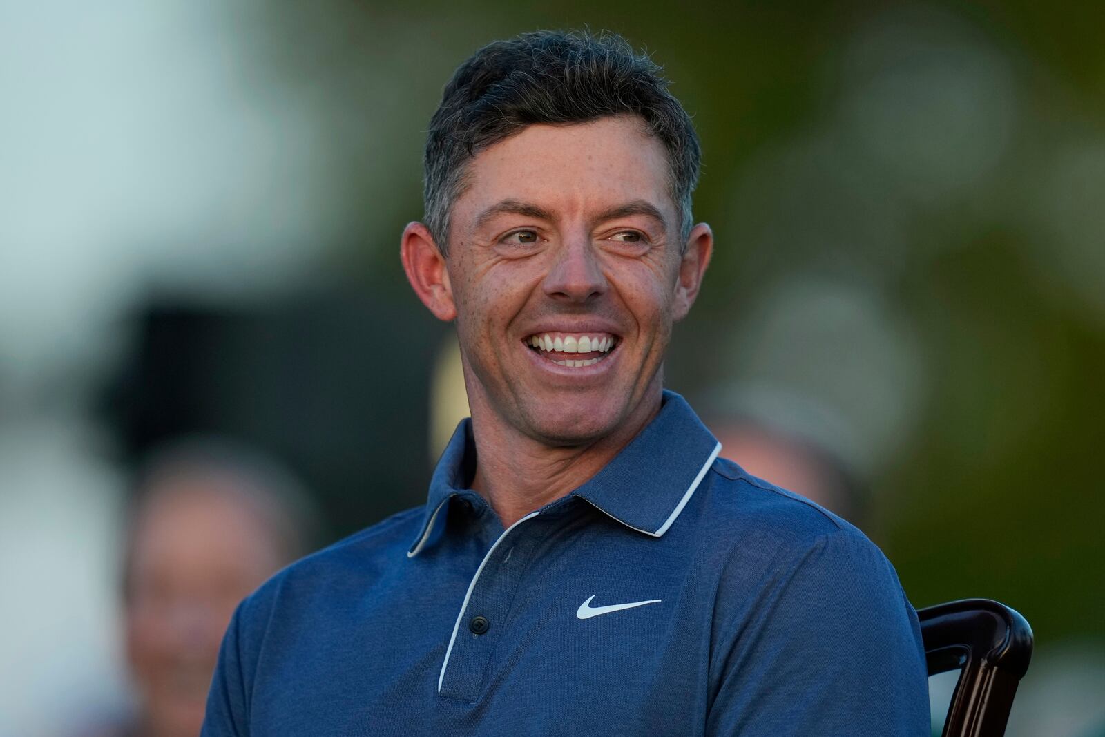 Rory McIlroy, of Northern Ireland, waits to put on the green Jacket after winning the Masters golf tournament, Sunday, April 13, 2025, in Augusta, Ga. (AP Photo/Ashley Landis)