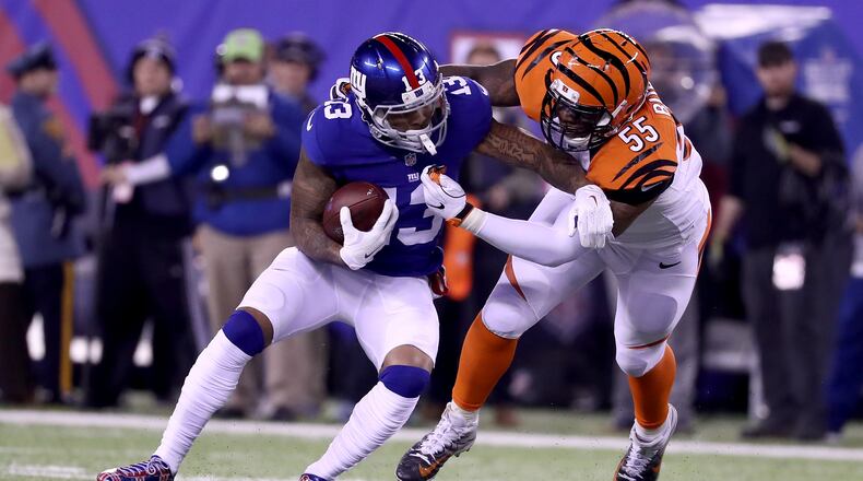 Bengals linebacker Vontaze Burfict, seen here tackling running back Giants running back Rashad Jennings last November 14 in a game at MetLife Stadium, has pleased team officials by working himself into excellent shape.