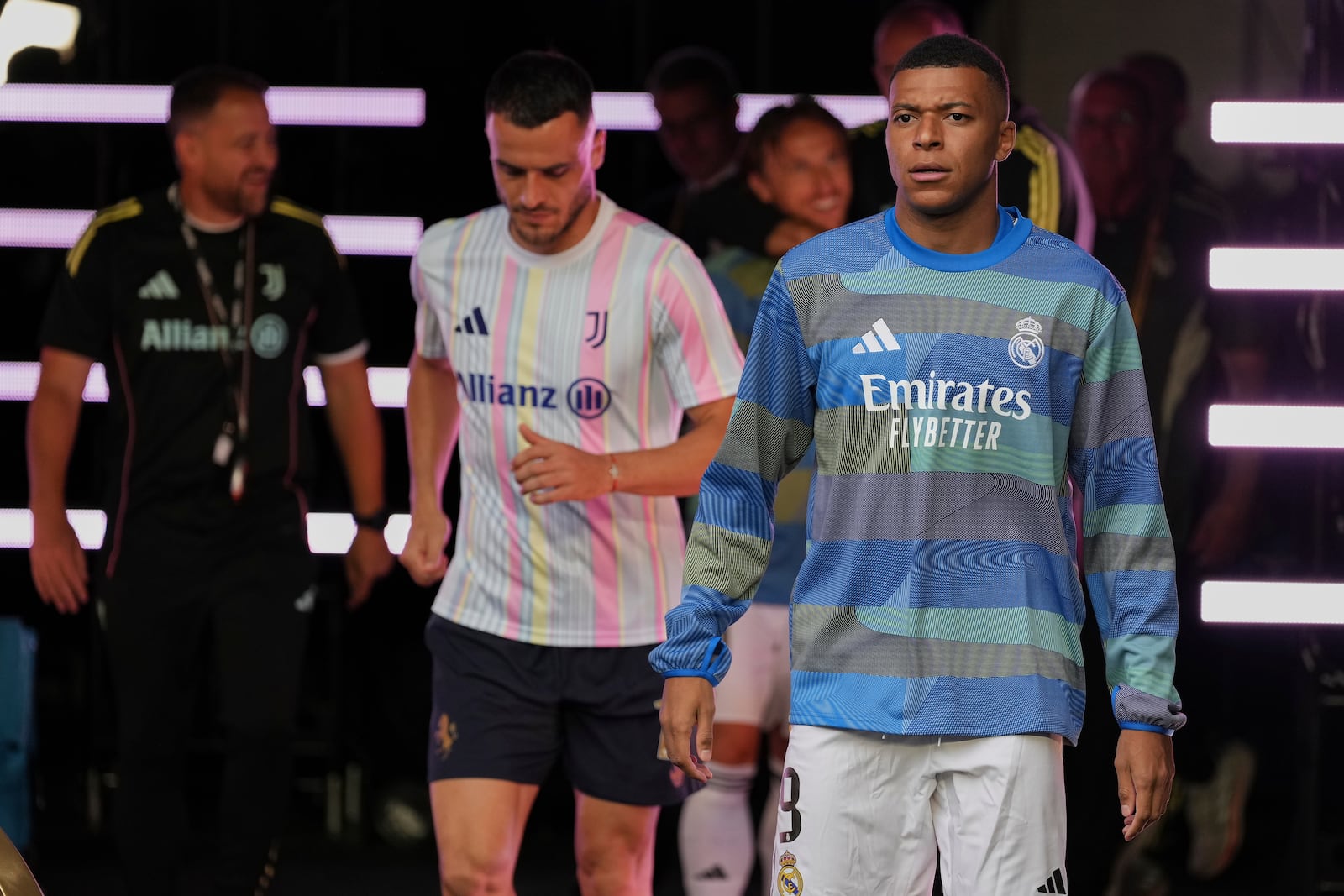Real Madrid's Kylian Mbappe walks out to the pitch before the Club World Cup round of 16 soccer match between Real Madrid and Juventus in Miami Gardens, Fla., Tuesday, July 1, 2025. (AP Photo/Rebecca Blackwell)