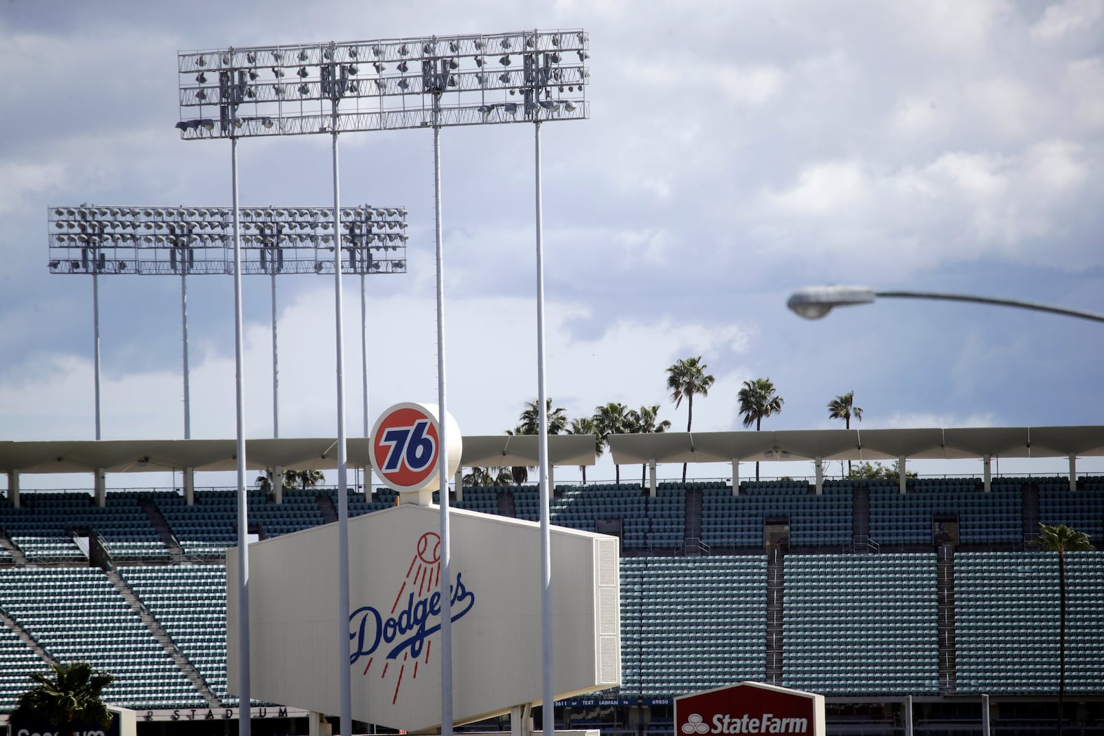 FILE - The exterior of Dodgers Stadium, home of the Los Angeles Dodgers is seen in Los Angeles on March 25, 2020. (AP Photo/Marcio Jose Sanchez, File)
