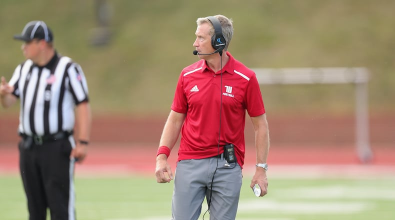 Wittenberg’s Jim Collins coaches during a game against Denison on Saturday, Sept. 30, 2023, in Granville. Photo by Jace Delgado, Denison University