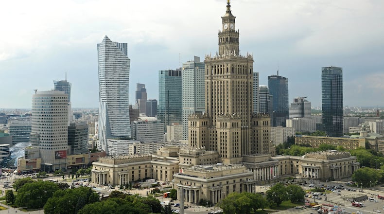 FILE - Newer skyscrapers flank the communist-era Palace of Culture and Science, foreground, in n, Poland, May 25, 2018. (AP Photo/Alik Keplicz, File)