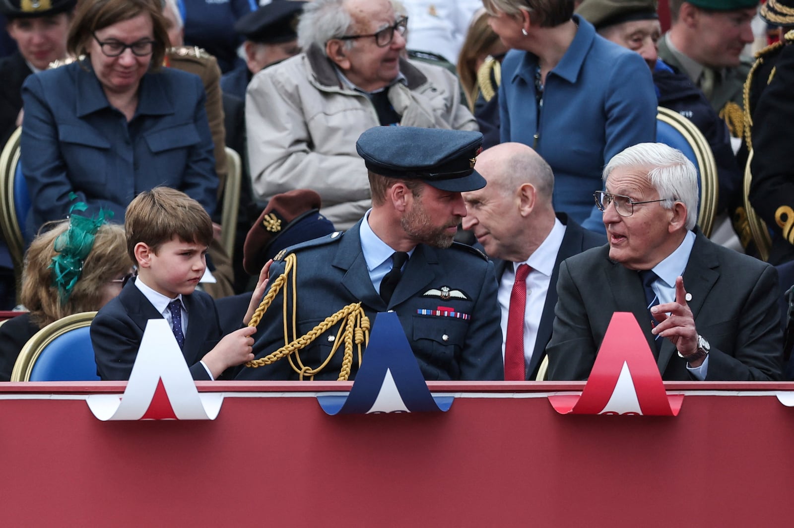 Britain's Prince William and Prince Louis watch the military procession marking the 80th anniversary of V-E Day, in London, Monday, May 5, 2025. (Toby Melville/Pool Photo via AP)