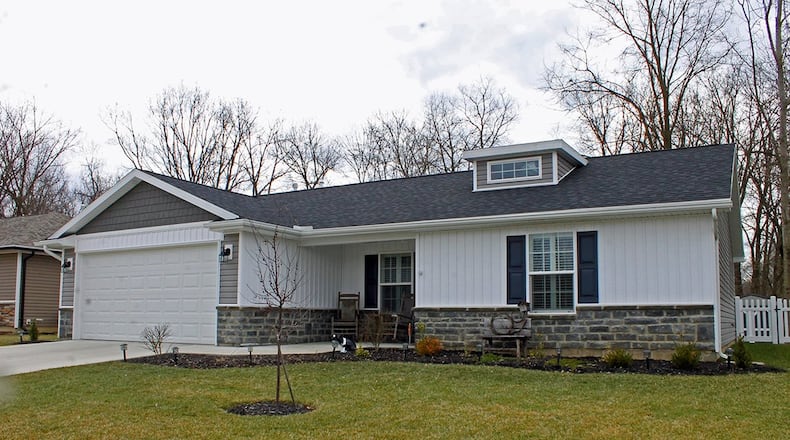 This 3-bedroom home with about 1,800 sq. ft. of living space offers an open concept floor plan in the main living area. The backyard has a new vinyl privacy fence. CONTRIBUTED PHOTO BY VICKIE KAPNAS