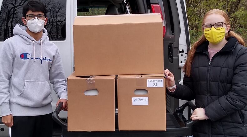 Ridgewood School students have supported Project Woman with a variety of volunteer opportunities and support such as contributing food for Thanksgiving. The students will be recognized with the organization's Purple Ribbon Award for their services at an event on Wednesday.