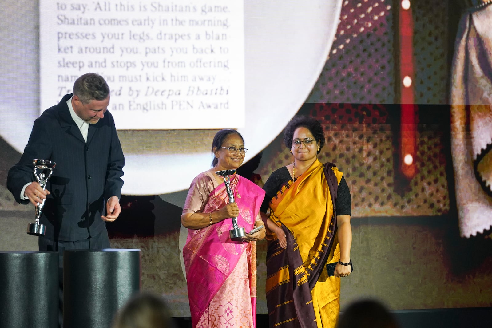 Banu Mushtaq, author of 'Heart Lamp', left, and Deepa Bhasthi react after winning the International Booker Prize, in London, Tuesday, May 20, 2025.(AP Photo/Alberto Pezzali)