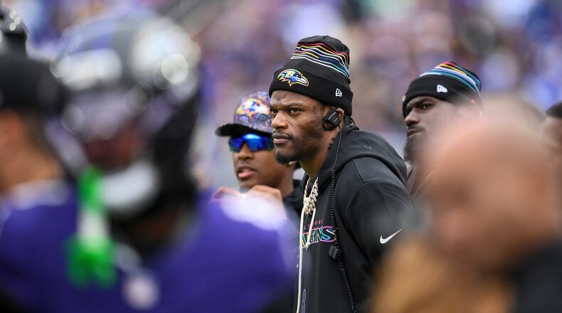 Baltimore Ravens quarterback Lamar Jackson looks on from the sidelines during the first half of an NFL football game against the Los Angeles Rams Sunday, Oct. 12, 2025, in Baltimore. (AP Photo/Nick Wass)