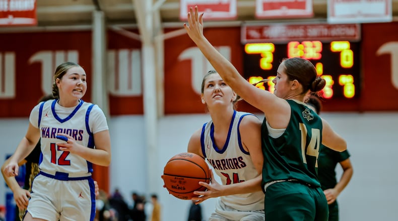 Northwestern High School sophomore Lily Bushey is guarded by Catholic Central junior Emma Evilsizor during their game on Tuesday, Dec. 30, 2025 at Wittenberg University's Pam Evans Smith Arena in Springfield. MICHAEL COOPER / STAFF
