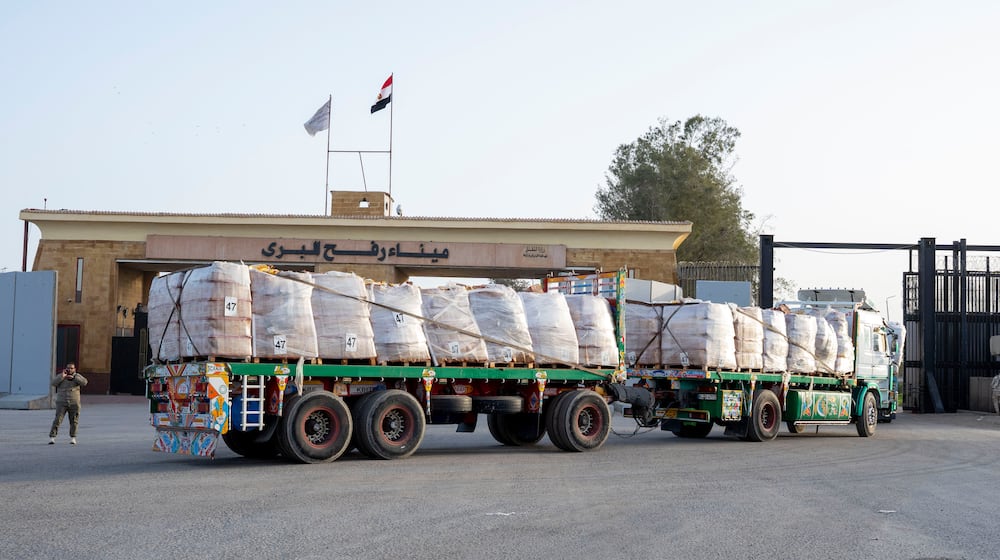 A truck enters the Egyptian gate of the Rafah crossing, heading for inspection by Israeli authorities before entering the Gaza Strip, Tuesday, Jan. 27, 2026. (AP Photo/Mohamed Arafat)