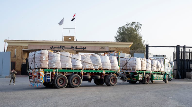 A truck enters the Egyptian gate of the Rafah crossing, heading for inspection by Israeli authorities before entering the Gaza Strip, Tuesday, Jan. 27, 2026. (AP Photo/Mohamed Arafat)