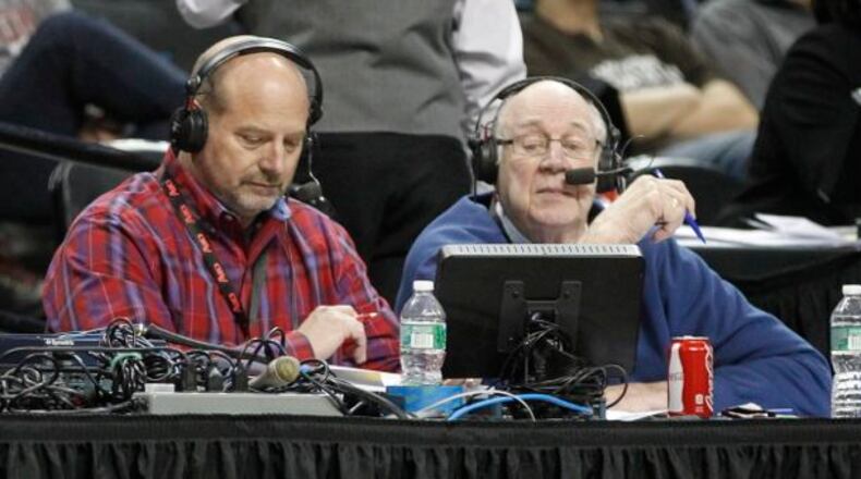 WHIO's Larry Hansgen, left, and Bucky Bockhorn broadcast the Flyers' victory over Fordham in the second round of the A-10 tournament on Thursday, March 13, 2014, at the Barclays Center in Brooklyn, N.Y.