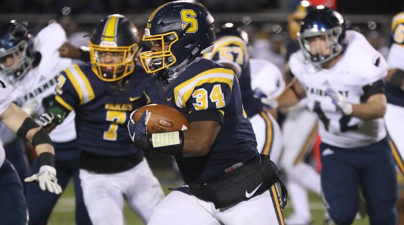 Springfield’s Tavion Smoot carries the ball against Fairmont. BILL LACKEY/STAFF