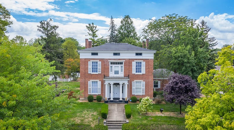 This 5-bedroom home offers approximately 6,880 sq. ft. of living space on 3 levels. The home has formal living and dining rooms and an attached, 3-car garage. CONTRIBUTED PHOTO