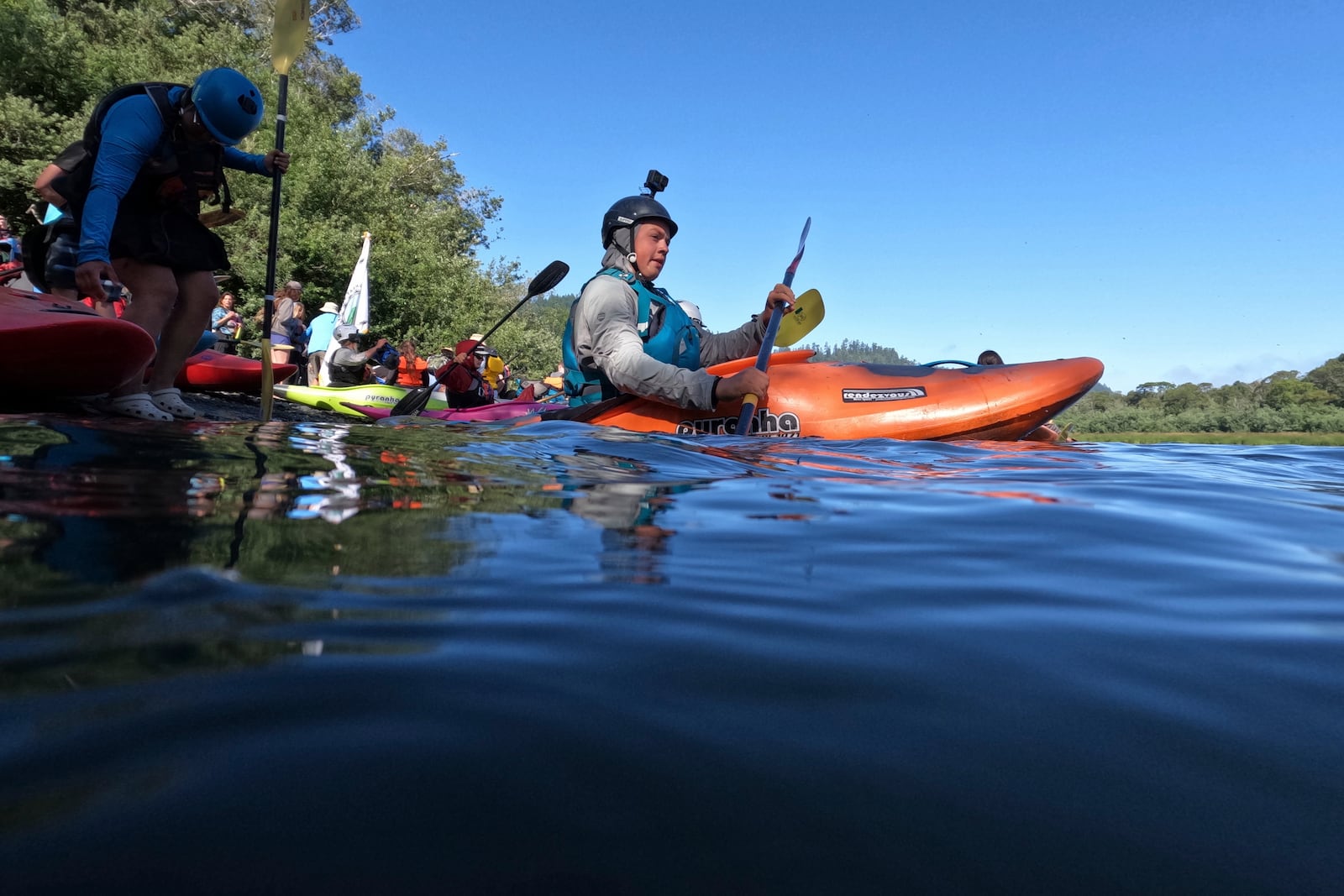 A kayaker begins the final day of paddling the Klamath River to reach the Pacific Ocean on Friday, July 11, 2025, in Klamath, Calif. (AP Photo/Brittany Peterson)