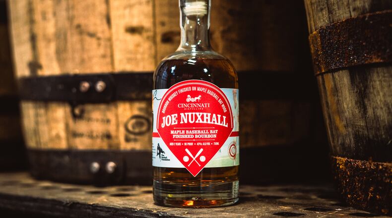 Cincinnati Distilling is launching next week the Joe Nuxhall Baseball Bat Aged Bourbon in collaboration with The Nuxhall Foundation. The limited edition 90-proof bourbon features an award-winning recipe that honors the Ol’ Lefthander, a Cincinnati Reds Hall of Fame pitcher and native Hamiltonian. The bourbon is available for pre-order and will be released on April 12, 2025, at a special event in downtown Cincinnati. PROVIDED