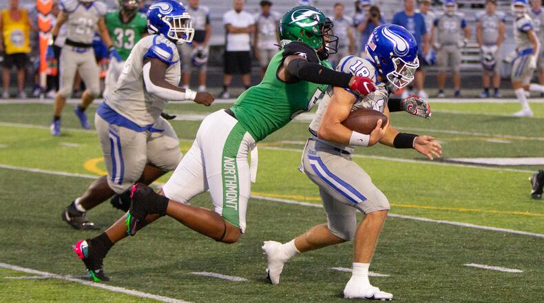 Northmont defensive end Cedric Works sacks Miamisburg's Preston Barr in the first half Thursday night. Jeff Gilbert/CONTRIBUTED