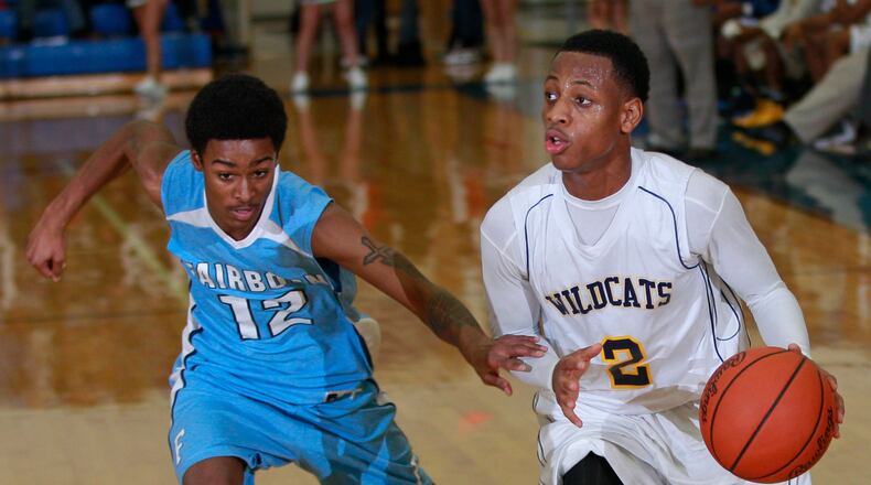 Kamarta' Curry (2) of Springfield is guarded by Arin Booth (12) of Fairborn during Friday's basketball game at Springfield on Dec. 6, 2012. Photo by Barbara J. Perenic/Cox Media Group
