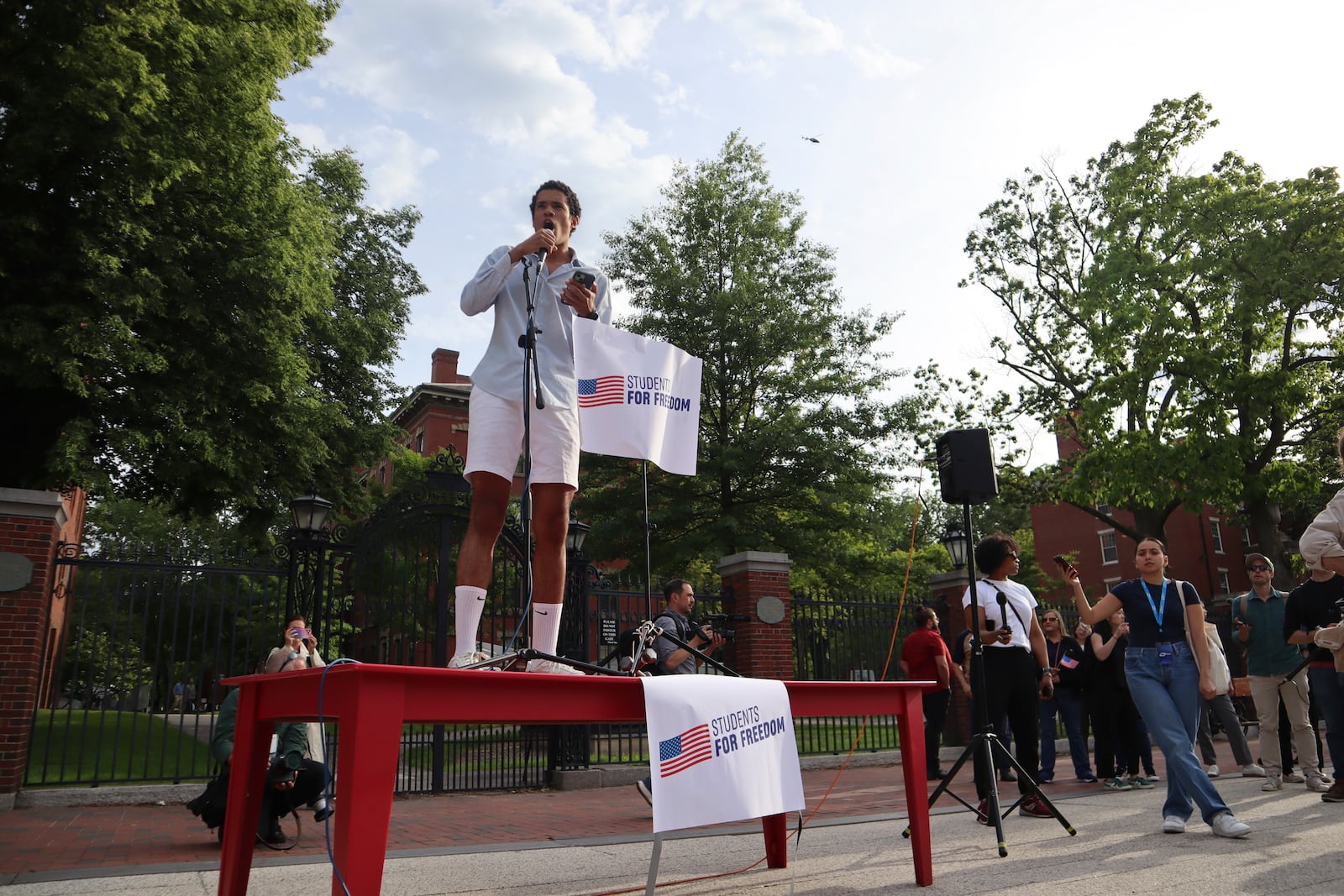 Nuriel Vera-DeGreff, a member of the Harvard University class of 2026, speaks at a protest against President Donald Trump's recent sanctions against Harvard in front of Science Center Plaza on Tuesday, May 27, 2025, in Cambridge, Mass. (AP Photo/Leah Willingham)