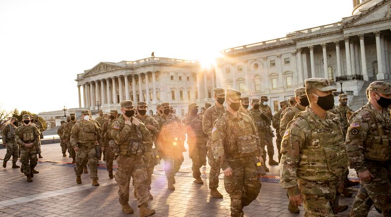 National Guard troops muster outside the Capitol in Washington, Thursday, Jan. 14, 2021. Federal investigators are trying to figuring out how many military and police personnel may have taken part in the violent attack on the Capitol, a law enforcement official said on Thursday. (Jason Andrew/The New York Times)