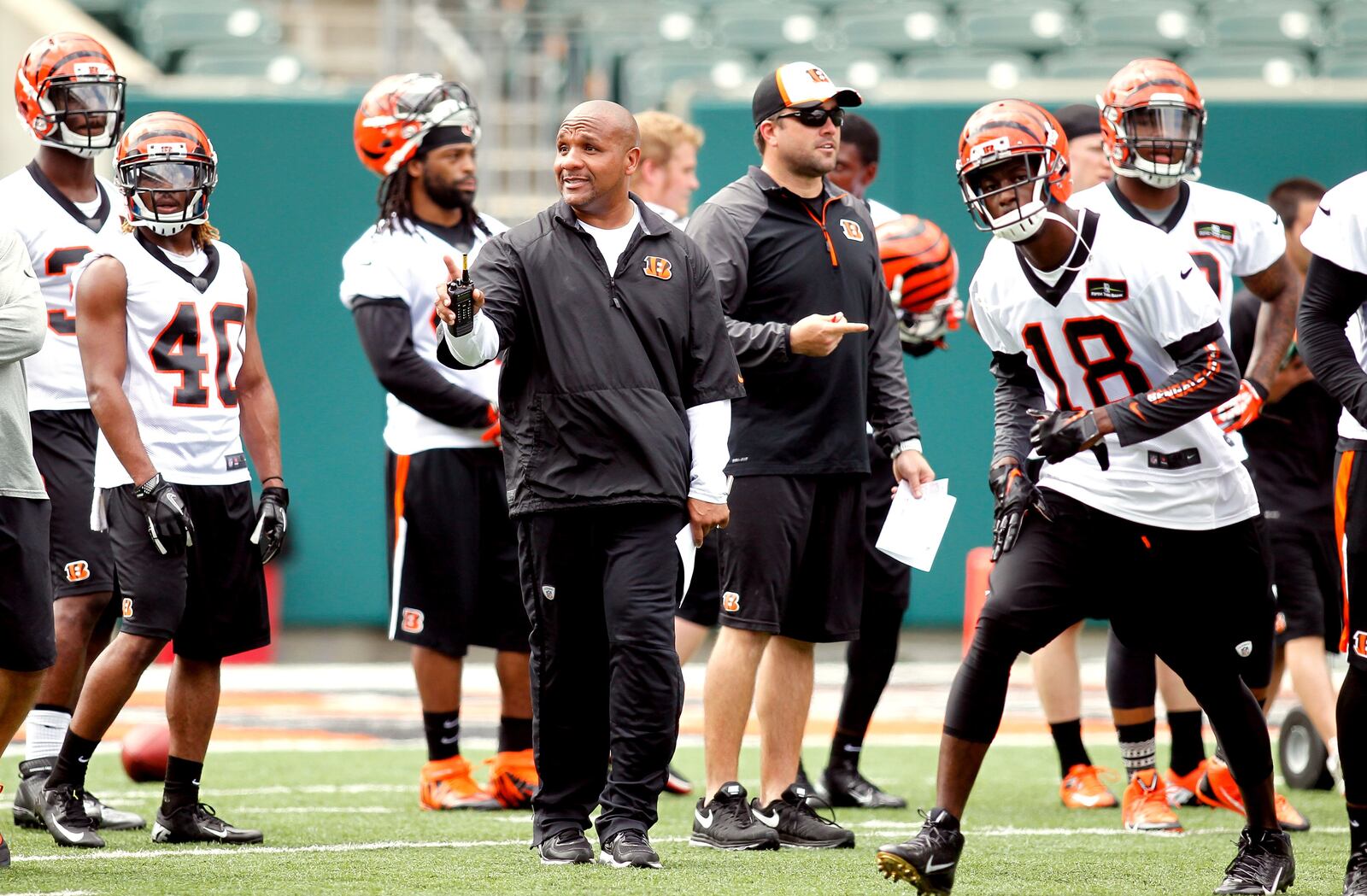 Cincinnati Bengals defensive coordinator Hue Jackson directs traffic during Official Team Activities Tuesday, June 3, 2014, at Paul Brown Stadium in Cincinnati. NICK DAGGY / STAFF