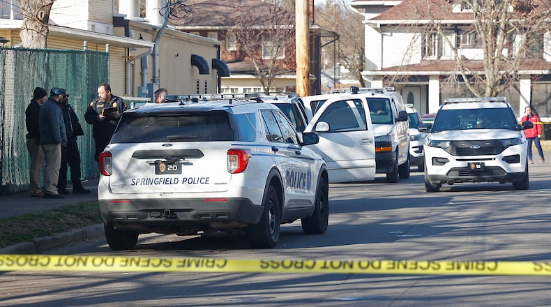 The Springfield Police Division investigate Chevy Tahoe, parked along Mason Street, where a man was found with a suspected gunshot wound to the head Tuesday, Feb. 6, 2024. BILL LACKEY/STAFF
