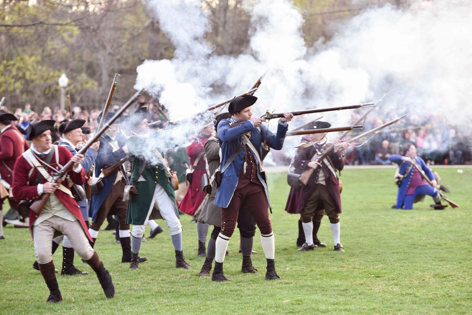 FILE - Colonial soldiers fire on the British during the Patriots' Day reenactment of the battles of Lexington and Concord, in Lexington, Mass. Monday, Aril 17, 2017. (Keith Viglione/The Boston Herald via AP,File)