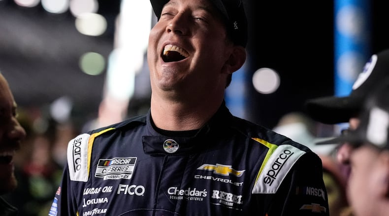 Kyle Busch speaks with his crew during NASCAR Daytona 500 qualifying, Wednesday, Feb. 11, 2026, in Daytona, Fla. (AP Photo/Mike Stewart)
