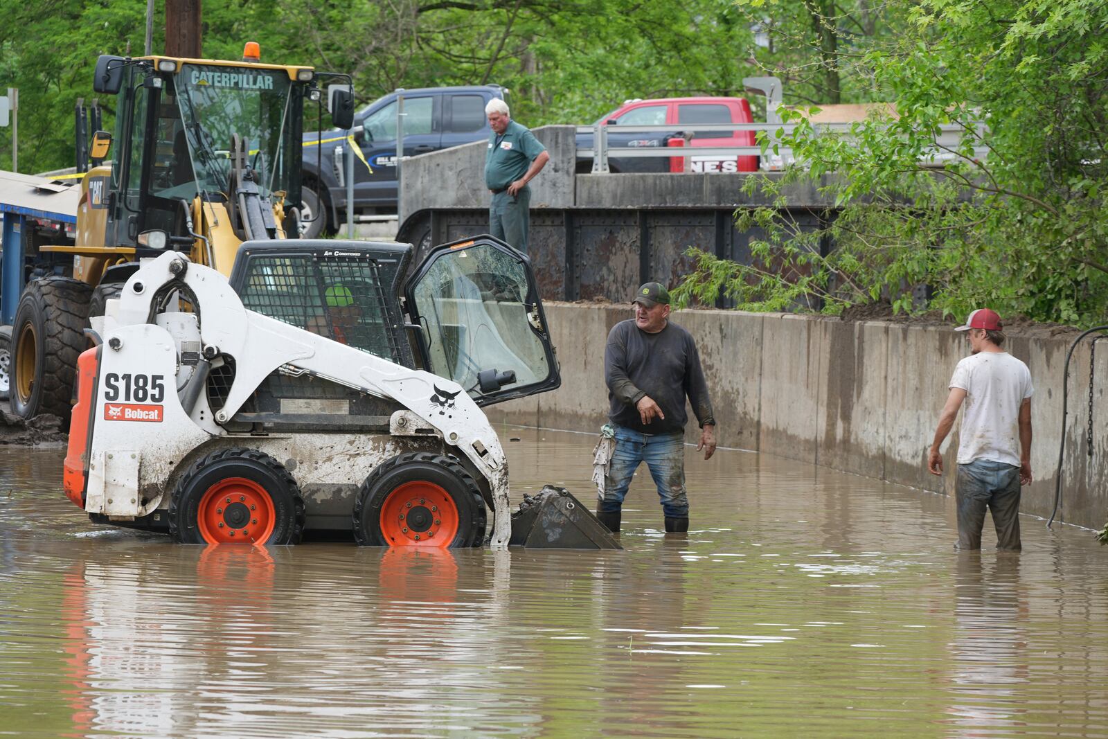 Work crews are trying to drain water as clean up continues after flooding on Wednesday, May 14, 2025 in Westernport, Md. (AP Photo/Gene J. Puskar)