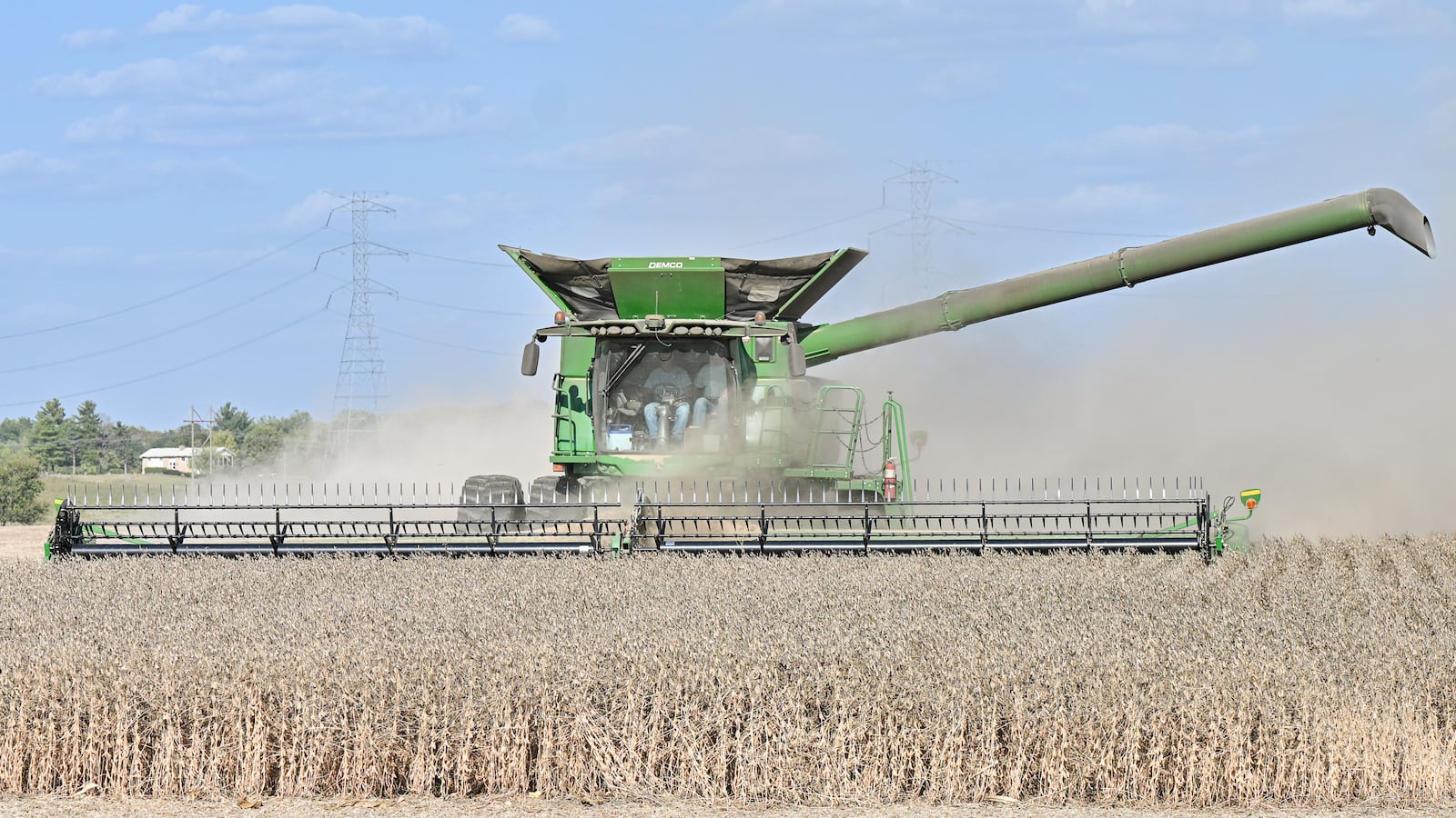 Farmers harvest soybeans in a field near Ohio 202 near Tipp City on Monday, Sept. 29, 2025. China has agreed to purchase 25 million metric tons of U.S. soybeans annually for the next three years as part of an agreement reached by its leaders, the Associated Press reported Thursday. BRYANT BILLING/STAFF