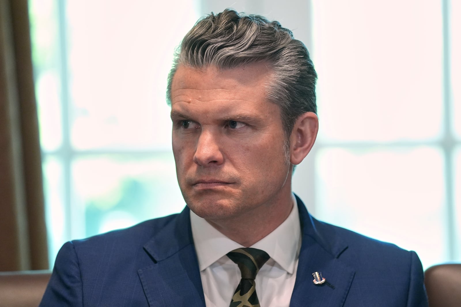 Secretary of Defense Pete Hegseth listens during a cabinet meeting at the White House, Wednesday, April 30, 2025, in Washington. (AP Photo/Evan Vucci)