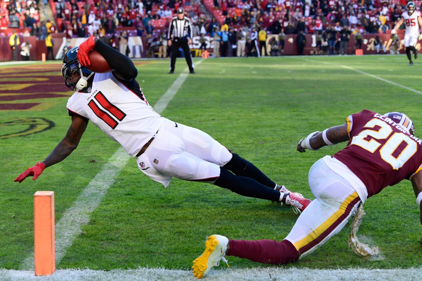 FILE - Atlanta Falcons wide receiver Julio Jones (11) dives past Washington Redskins free safety Ha Ha Clinton-Dix (20) and into the end zone for a touchdown during the second half of an NFL football game, Sunday, Nov. 4, 2018, in Landover, Md. (AP Photo/Susan Walsh, File)