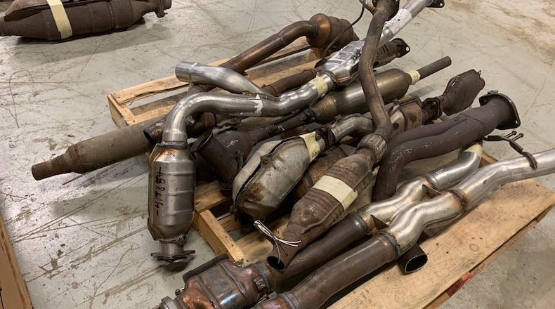 In this undated photo provided by the Utah Attorney General's Office, catalytic converters are shown after being seized in a recent investigation. Utah lawmakers are considering a crackdown on theft of the emission control devices from cars that are stolen for the precious metals found inside. (Utah Attorney General's Office via AP)