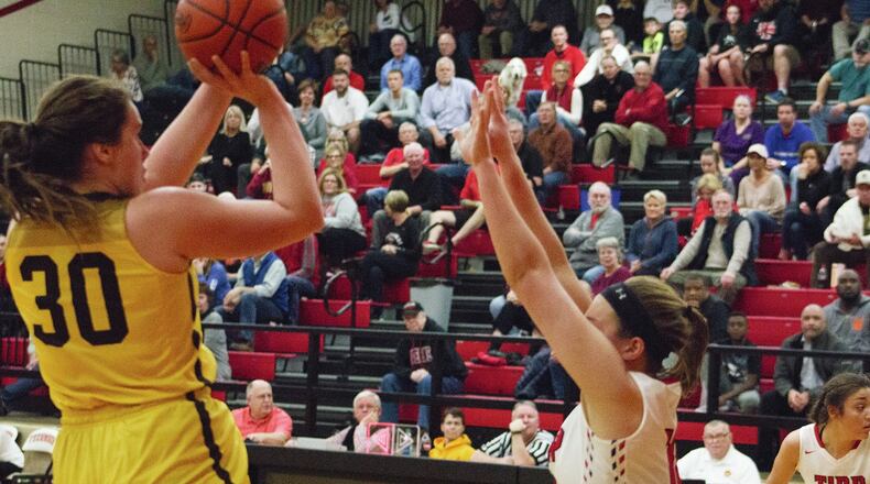 Kenton Ridge’s Mikala Morris shoots over Tippecanoe’s Hailee Varvel on Tuesday night at Tecumseh. Morris scored 12 points in a 48-43 loss to Tipp. JEFF GILBERT / CONTRIBUTED