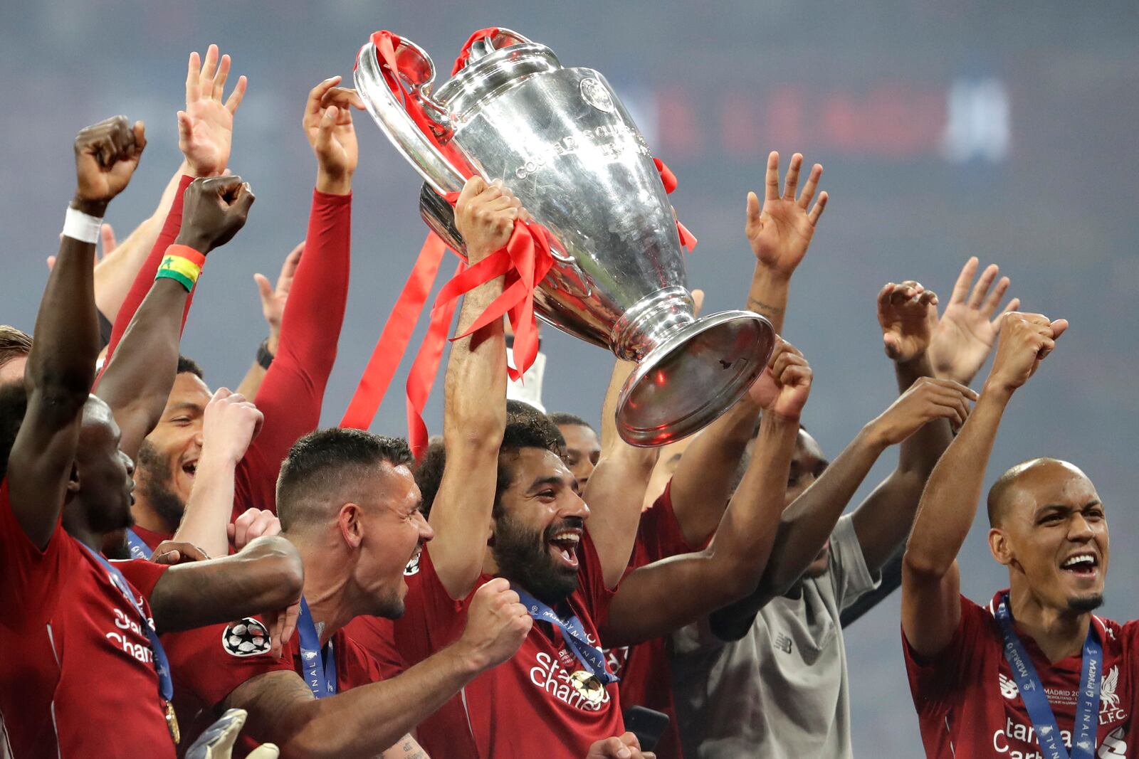 FILE - Liverpool's Mohamed Salah lifts the trophy after winning the Champions League final soccer match between Tottenham Hotspur and Liverpool at the Wanda Metropolitano Stadium in Madrid, on June 2, 2019. (AP Photo/Felipe Dana, File)