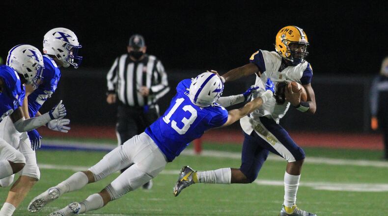 Springfield's Te'Sean Smoot runs against St. Xavier in a Division I state semifinal on Friday, Nov. 6, 2020, at Alexander Stadium in Piqua. David Jablonski/Staff